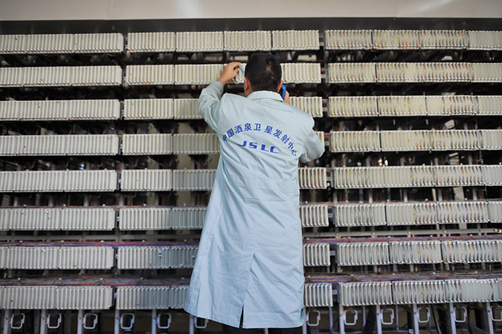 China space launch: A worker at the Jiuquan Satellite Launch Centre runs checks