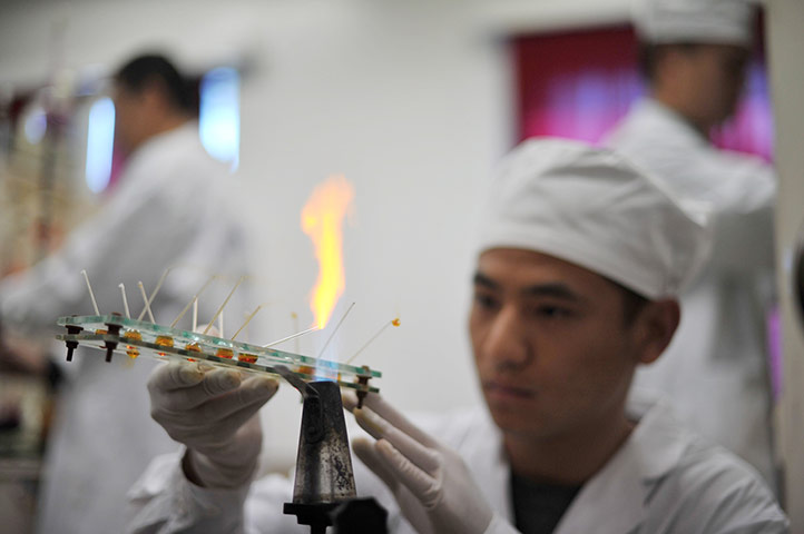 China space launch: A worker at the Jiuquan Satellite Launch Centre runs tests