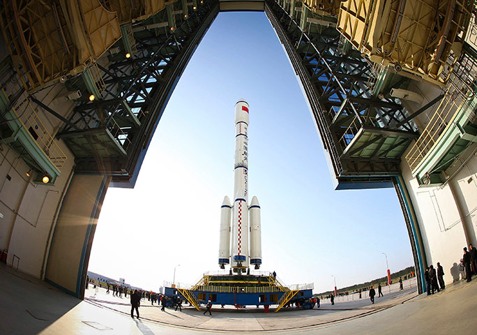 China space launch: Long March II-F rocket is transport to the launcher, China