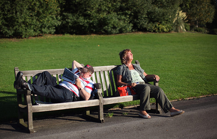 Hot Weather in the UK: People relax in the sunshine in a Garden in Regents Park