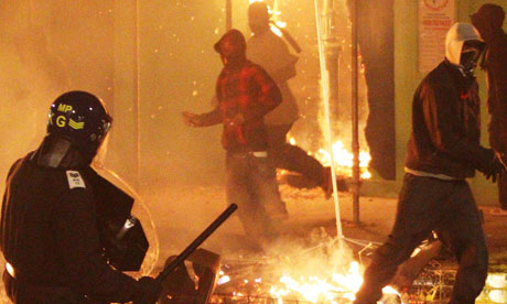 Police and youths on the streets of Tottenham during the riots