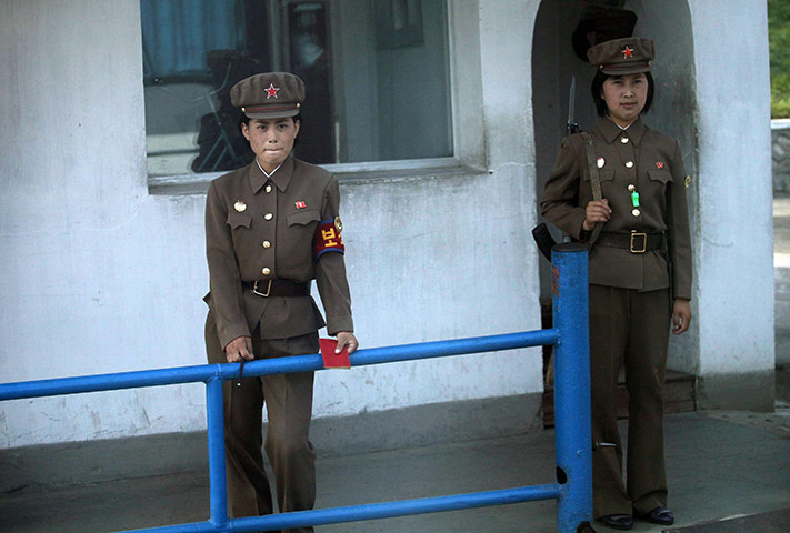 24 hours: Rajin, North Korea: Female soldiers guard the entrance of the port 