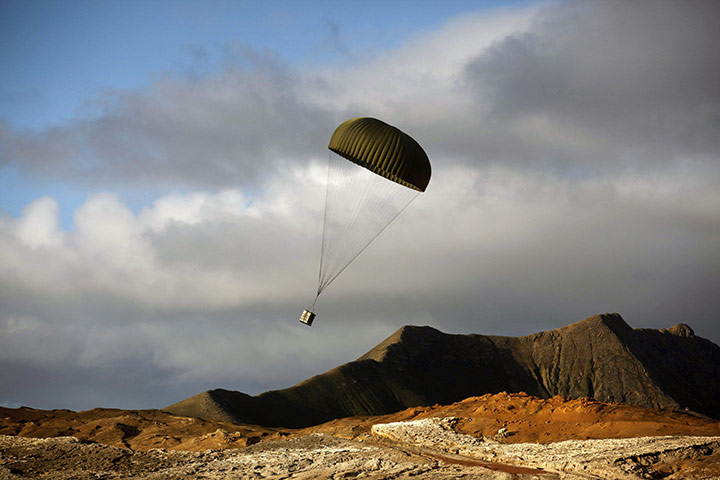 24 hours: Juan Fernandez islands, Chile: A parachute is dropped by a military plane