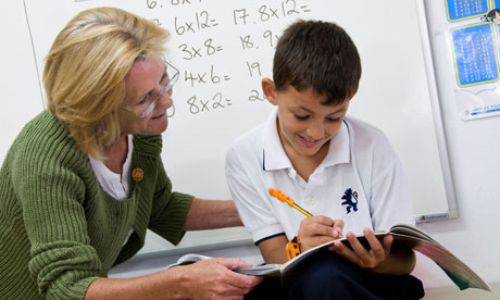 Teacher and pupil in classroom