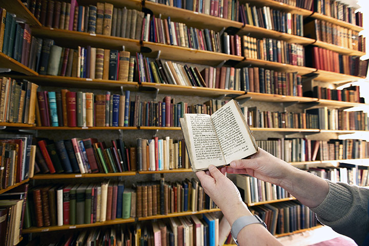 Working Class library: Project Librarian Jane Taylor with the oldest book in the collection