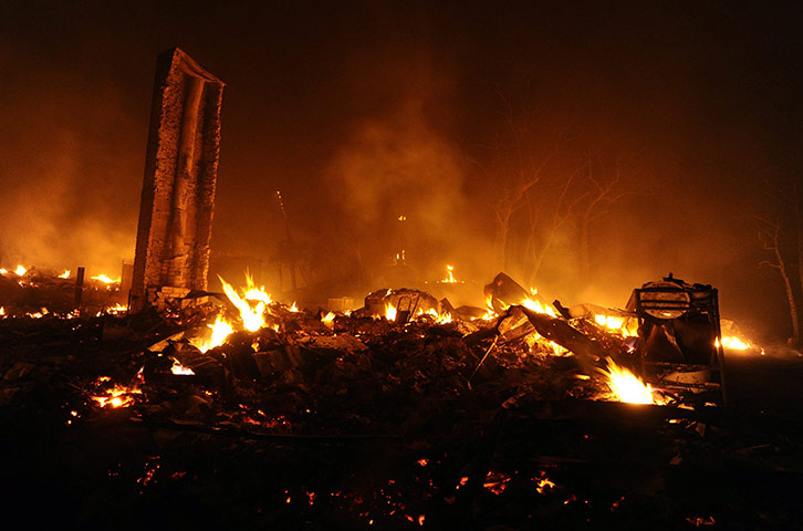 Texas Wildfires: Fires still burning a house in Bastrop, Texas