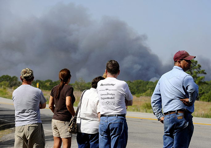 Texas Wildfires: People watch from a distance as a wildfire burns near Bastrop, Texas