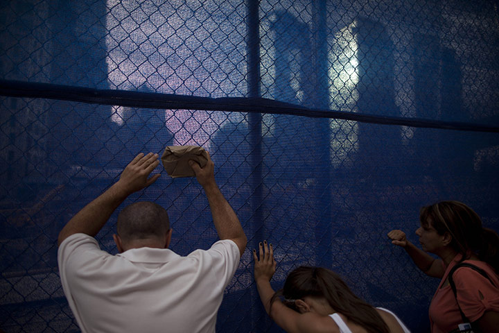 24 hours in pictures: Tourists look over the ground zero construction site 