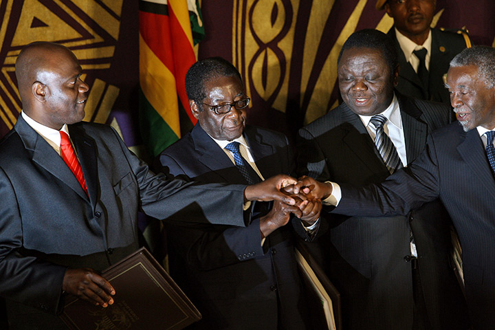 Robert Mugabe: September 2008: Leader pose after signing a power-sharing accord