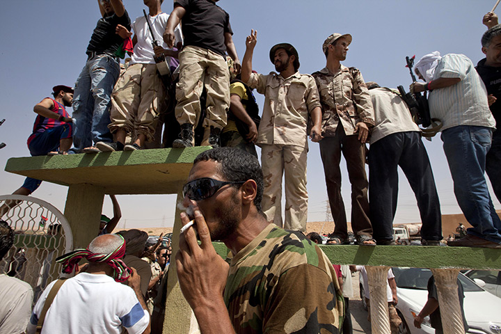 Sean Smith: Bani Walid: NTC fighters celebrate at a checkpoint between Tarhouna and Bani Walid