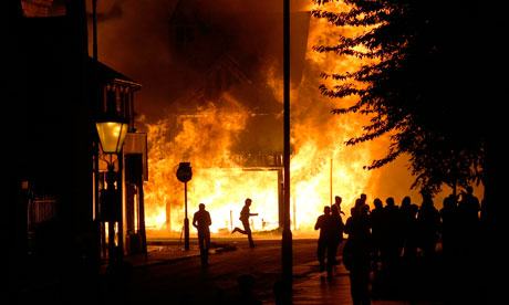 A shop is set on fire during the London riots