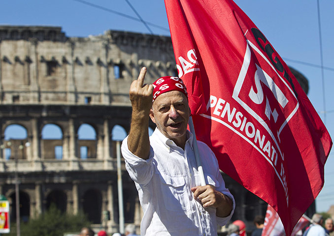 Italy strike: A protestor gestures during general strike in Rome