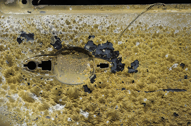 Wildfires damage: The paint bubbles on the door of a burnt car near Bastrop, Texas