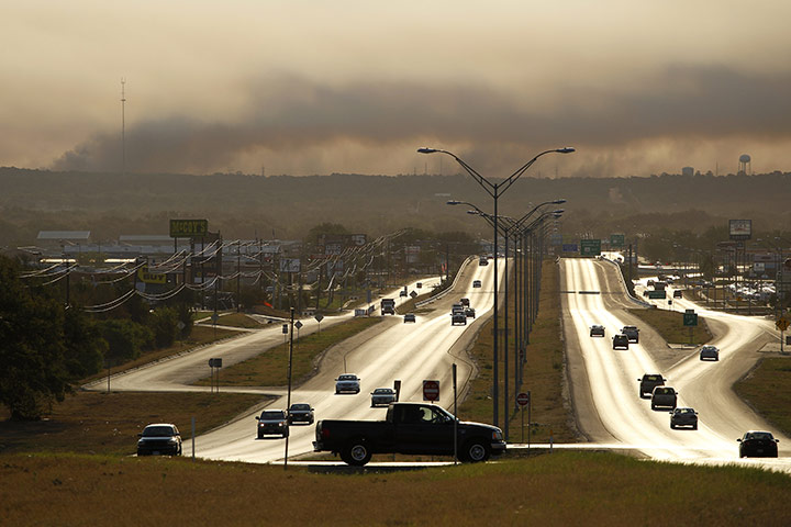 Wildfires damage: Smoke from a wildfire hangs in the sky in Bastrop, Texas