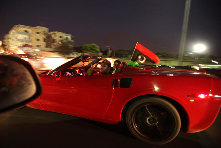 24 hours in pictures: youths waves flags in Tripoli