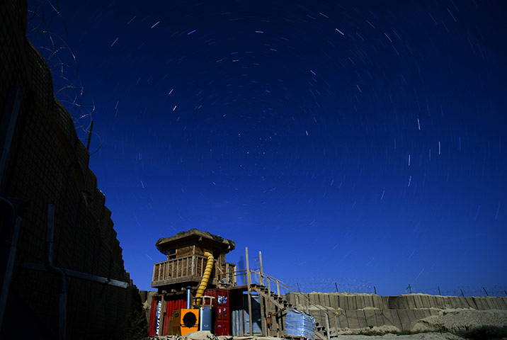 24 hours in pictures: Star trails over a US watchtower at Forward Operating Base Kuschamond 