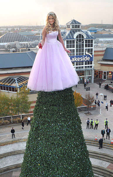 Fashion graveyard: Chantelle Houghton on top of Christmas tree at the Lakeside Shopping Centre