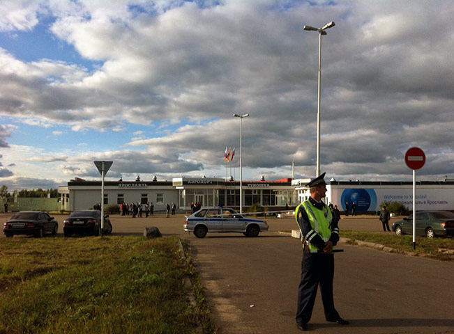 Russia plane crash: A policeman stands guard near the site of a plane crash in Yaroslavl
