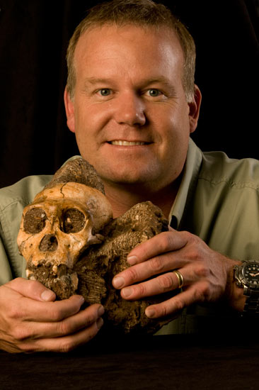 Primitive hominin: Prof Lee Berger with the Australopithecus sediba cranium