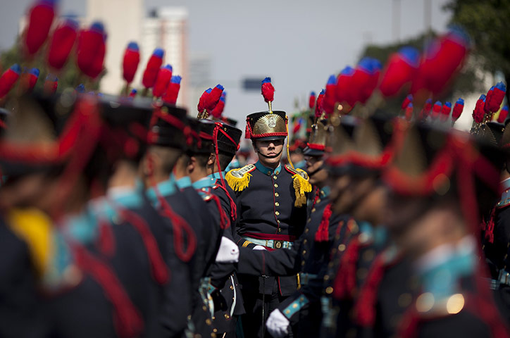 24 hours in pictures: Rio De Janeiro, Brazil: Soldiers march during a military parade