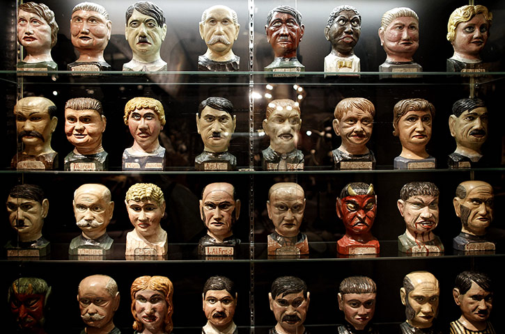 24 hours in pictures: Paris, France: Wooden models of heads are displayed in an auction house