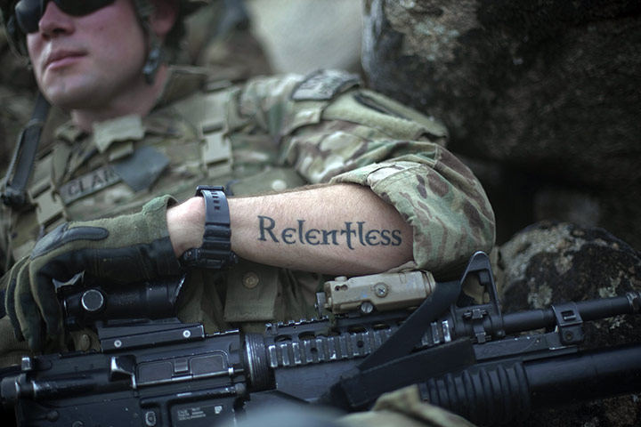 24 hours in pictures: Jaj, Afghanistan: A tattoo reading relentless