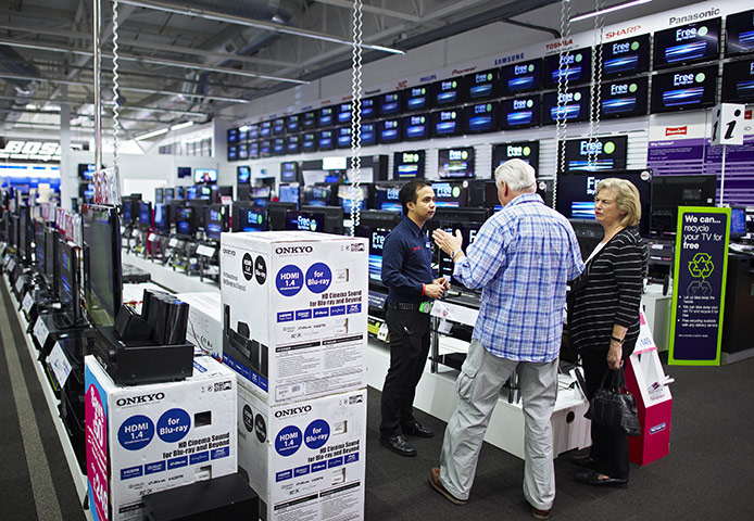 Week in Business: Customers inside a Currys store, London