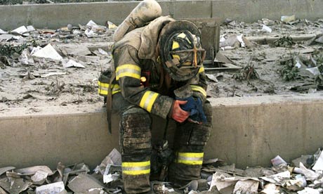 Firefighter searching the rubble after 9/11 attack