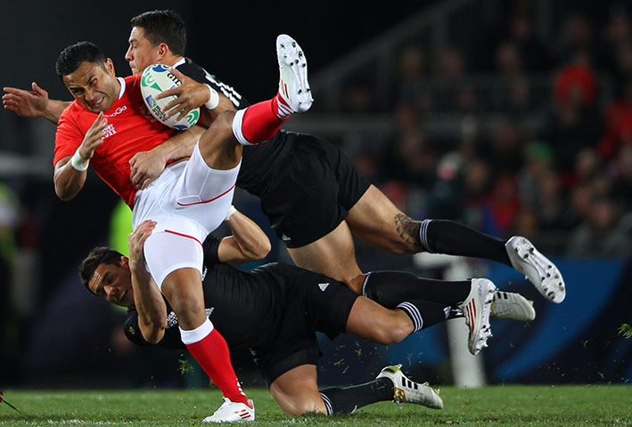 RWC game 1: Dan Carter and Sonny Bill Williams combine to tackle Tonga's Andrew Ma'ilei