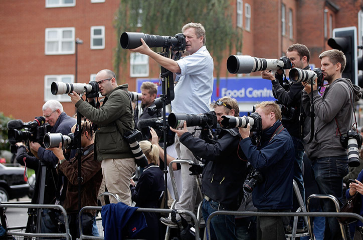 Funeral of Mark Duggan: Photographers and members of the press work behind a barrier