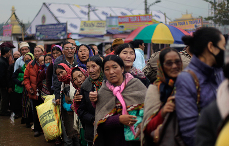 24 hours: Bodh Gaya, India: Buddhist devotees queue on the first day of Kalachakra