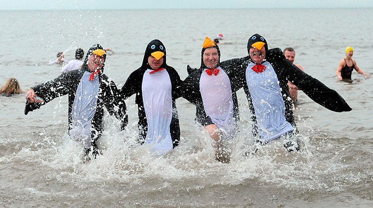 New Years day swimmers: People enjoy a New Year's Day dip at Whitley Bay in Northumberland