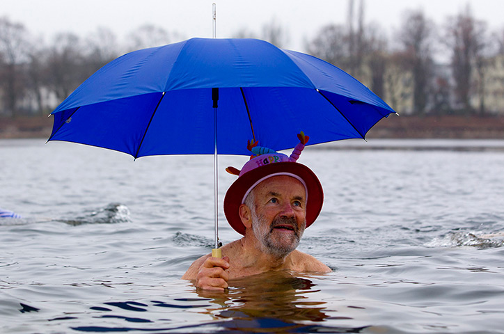 New Years day swimmers: Berlin Seals ice swimmers club take a dip in the Oranke Lake, Berlin
