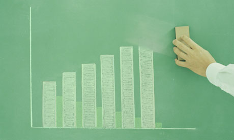 Man erasing bar chart from chalkboard