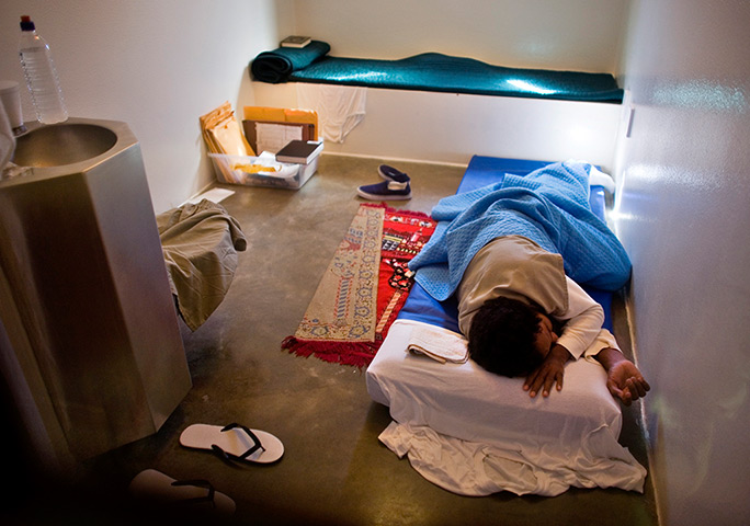 Inside Guantanamo: A Guantánamo detainee sleeps in his cell in the Camp 5 detention facility