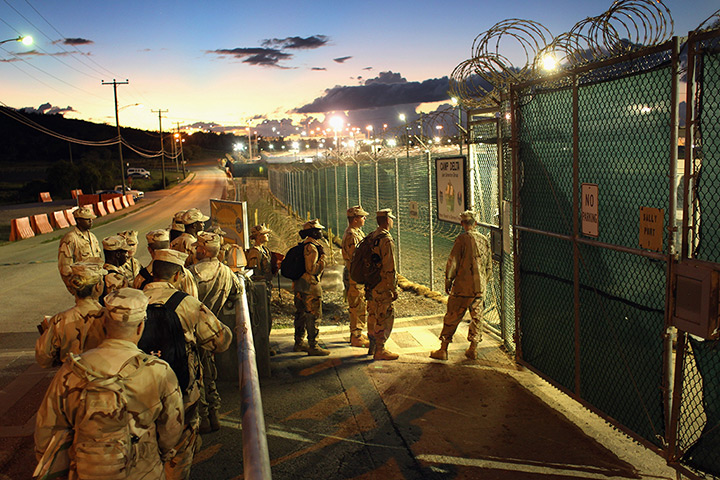 Inside Guantanamo: US military guards arrive for their sunrise shift at Camp Delta