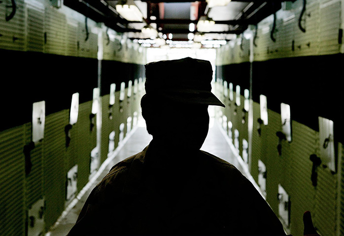 Inside Guantanamo: A member of the US Military inside the cell block at Camp 2 at Camp Delta 