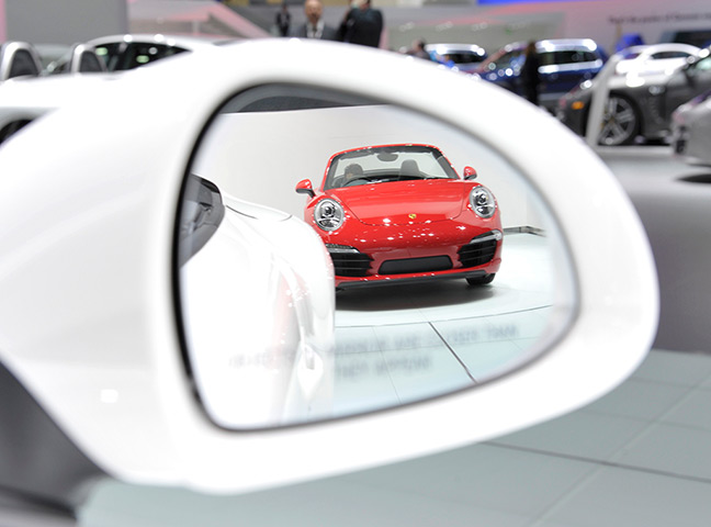 Detroit Motor Show: A Porsche 911 Carrera convertibl reflected in the mirror of another car