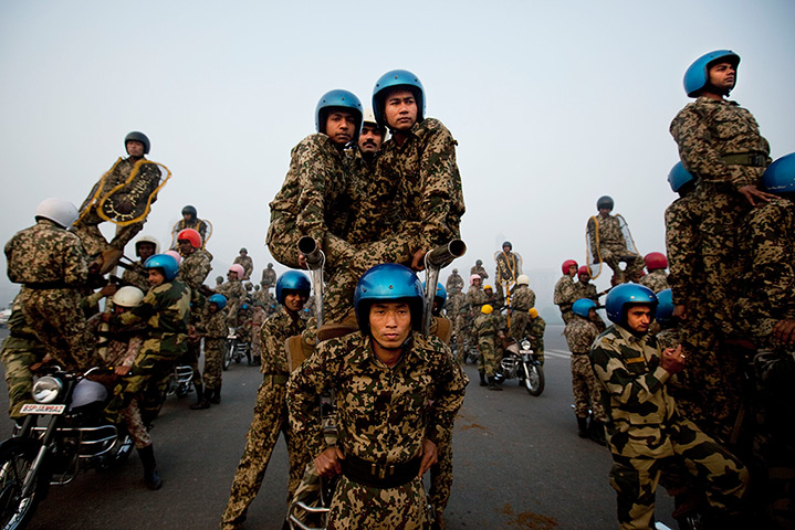 24 hours in pictures: Indian soldiers sit  on stunt motorcycles for Republic Day parade