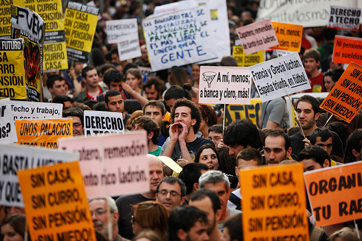 24 hours in pictures: A protester shouts slogans during a demonstration in Madrid