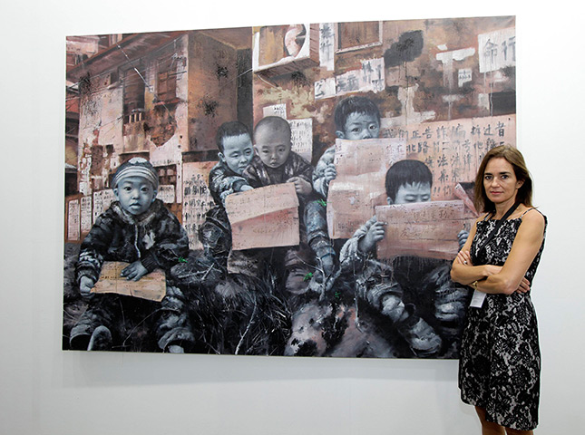 Week in business: Kashya Hildebrand poses for photos in front of an artwork