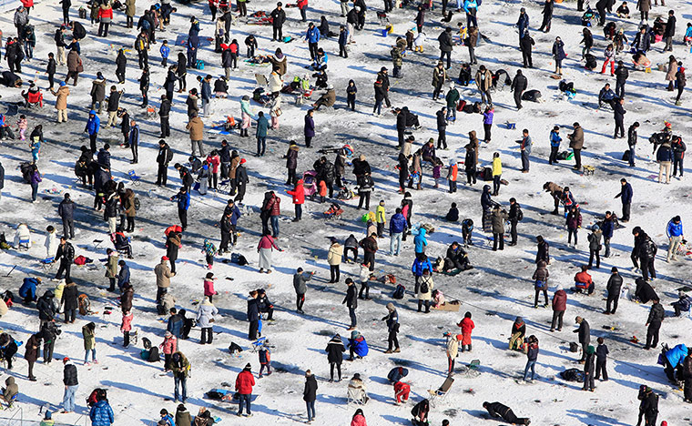 Sport pics of the week: Anglers cast lines through holes during an ice fishing competition