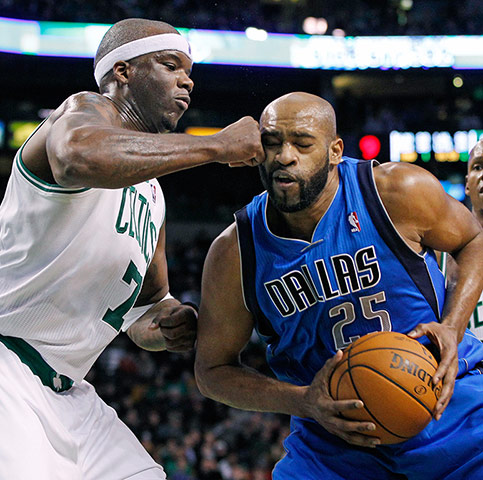 Sport pics of the week: Dallas Mavericks Vince Carter drives into Boston Celtics Jermaine O'Neal