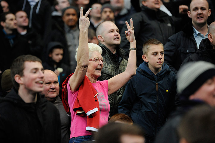 Sport pics of the week: A Manchester United fan gestures to the City fans