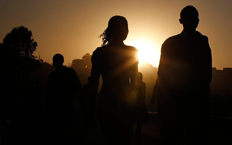 24 hours: Nairobi, Kenya: Pedestrians walk on a bridge along Nairobi-Thika highway 