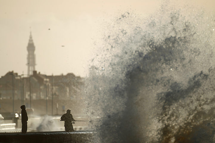 24 hours: Blackpool, England: Fishermen brave the wind whipped waves