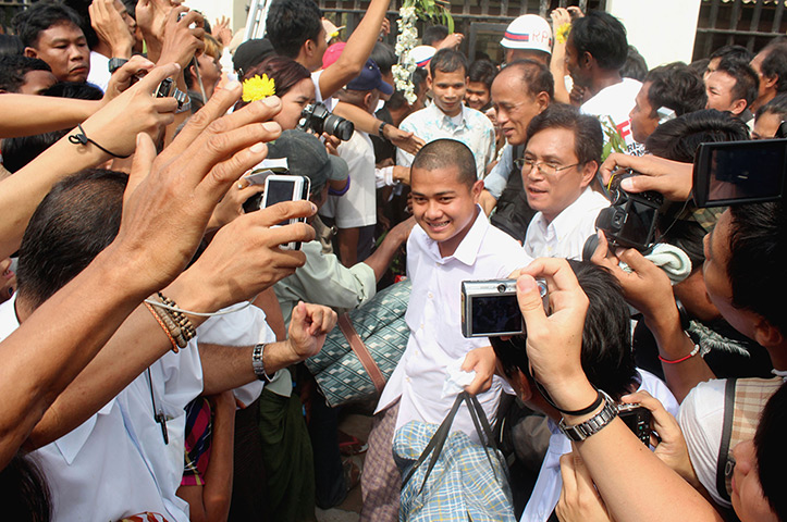 Burma prisoner released: Released prisoners walk out of Insein jail in Rangoon