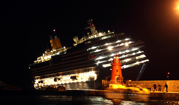 Cruise liner runs aground in Italy - in pictures | World news ...