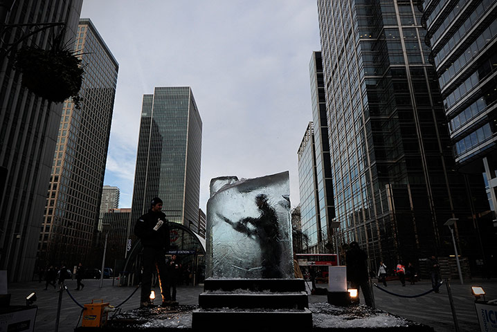 24 Hours: An ice sculpture works on a block of ice at the Ice Sculpting Festival