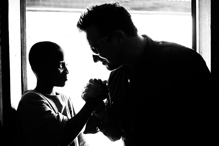 Bono in Ghana: Bono chats to a young boy